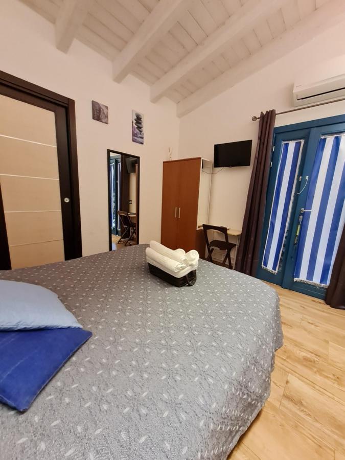 Portopollo Surfhouse Barrabisa Eksteriør billede