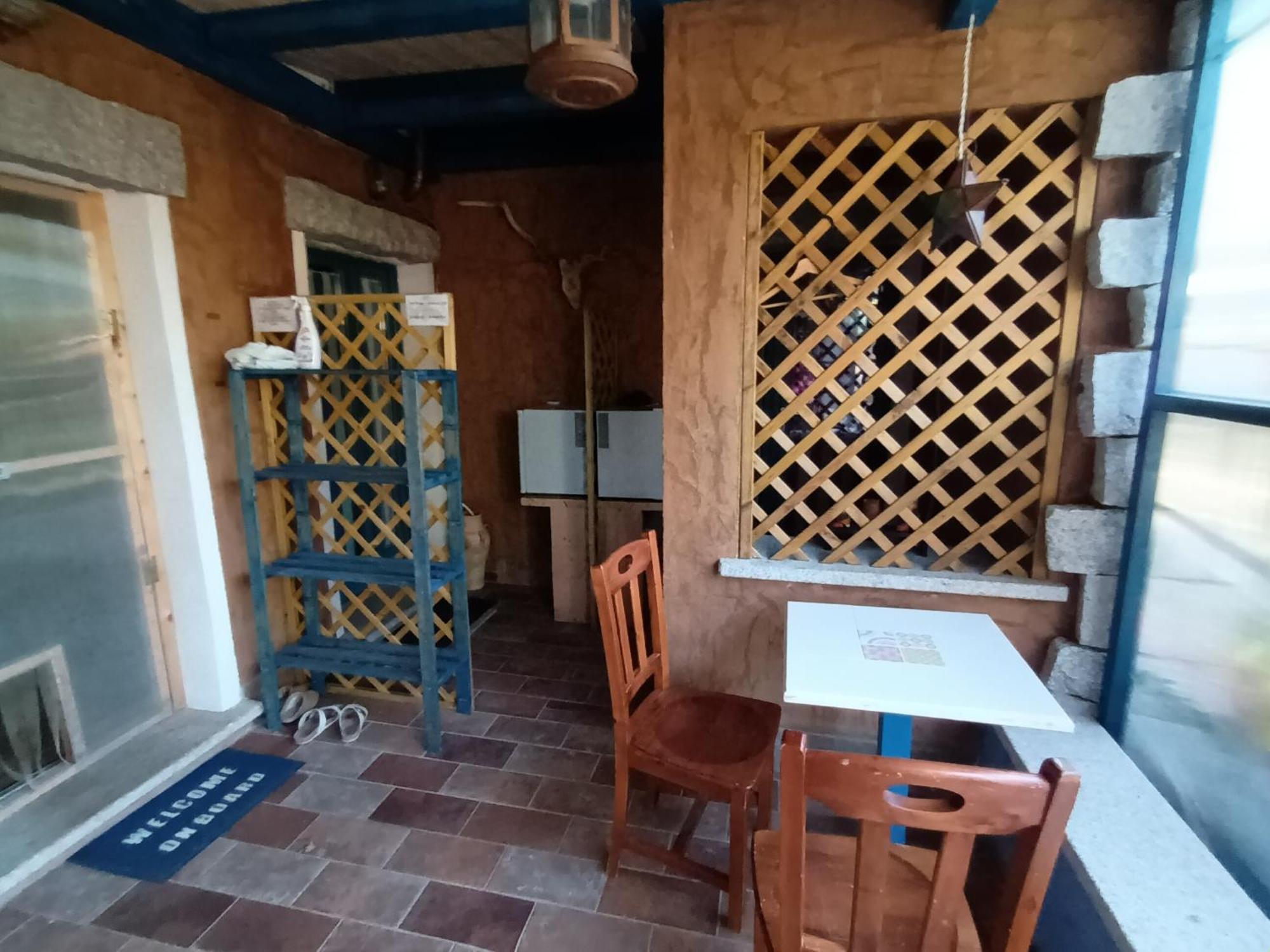 Portopollo Surfhouse Barrabisa Eksteriør billede