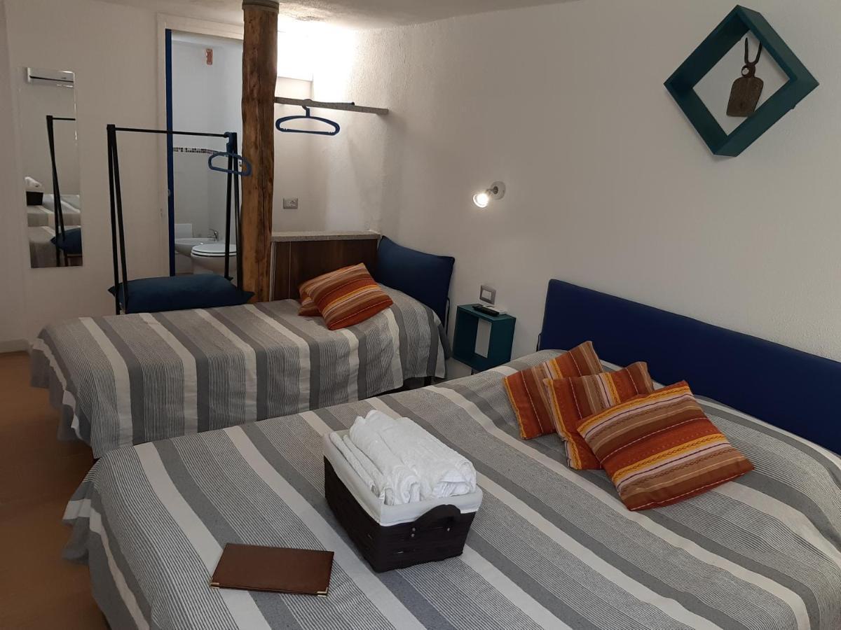 Portopollo Surfhouse Barrabisa Eksteriør billede